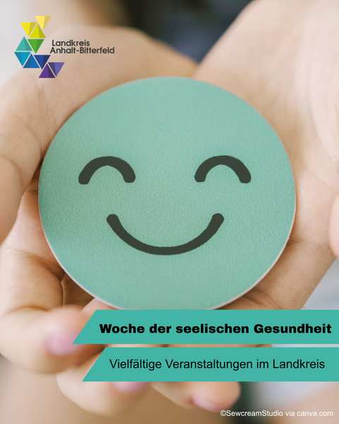 Zwei Hände halten ein lachendes Papier-Smiley &copy; Landkreis Anhalt-Bitterfeld via canva.com